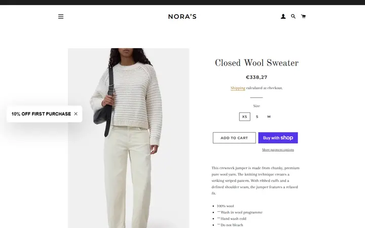 Website page titled Closed Wool Sweater – Nora’s