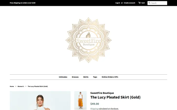Website page titled The Lucy Pleated Skirt (Gold) – SweetFire Boutique