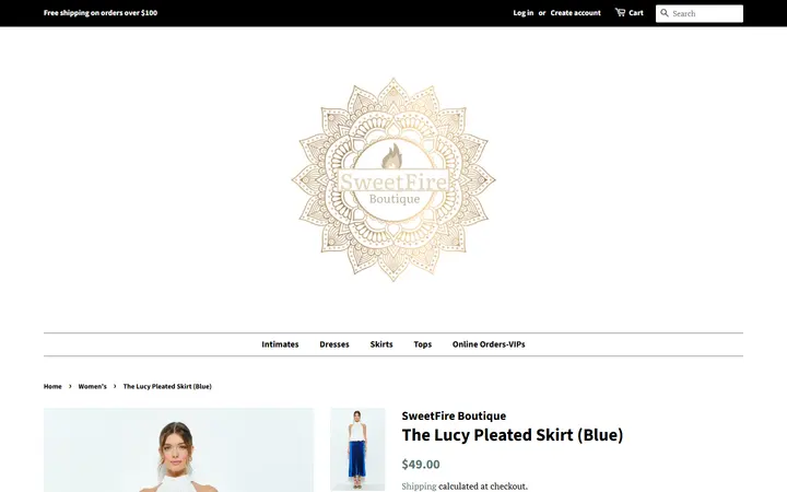 Website page titled The Lucy Pleated Skirt (Blue) – SweetFire Boutique