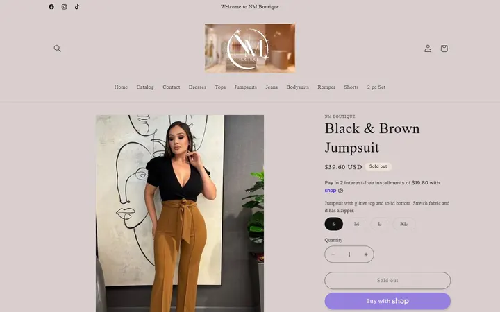 Website page titled Black & Brown Jumpsuit – NM Boutique