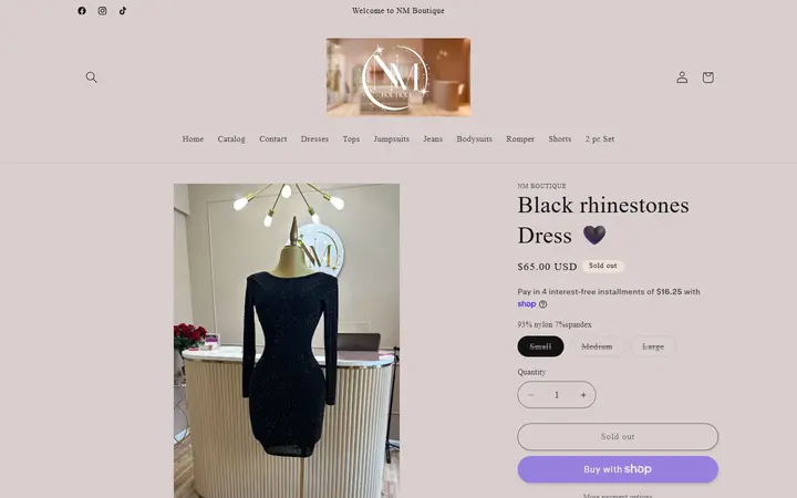 Website page titled Black rhinestones Dress 🖤 – NM Boutique