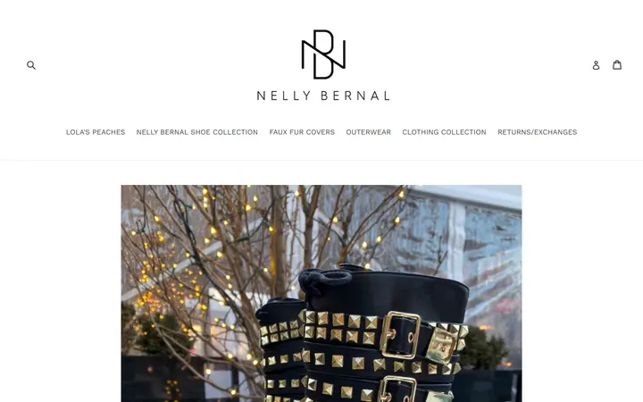 Website page titled Animaal Black Booties With Gold Ornaments – nellybernalcollection.com