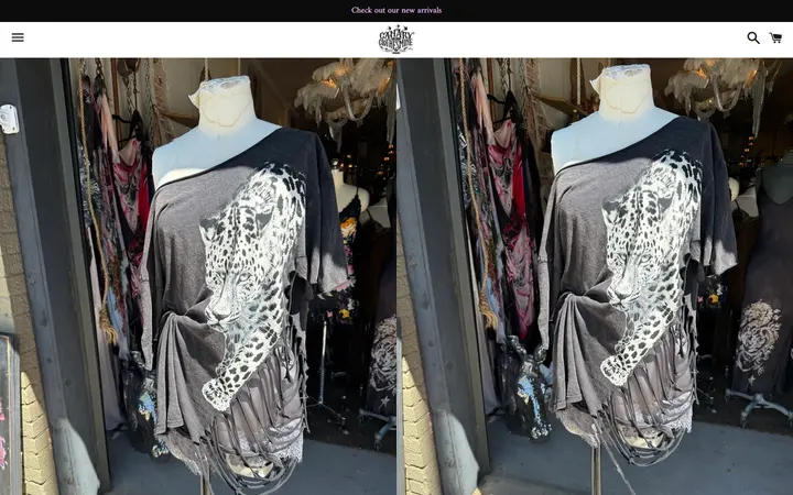 Website page titled Big Cat Ripped T – Canary In A Clothesmine